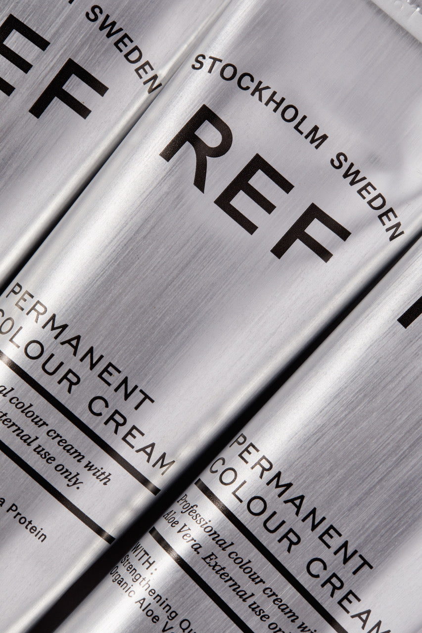 Close-up of REF Stockholm Sweden permanent color cream packaging